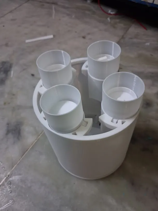 Batch of white 3D printed cylindrical housings