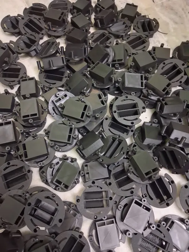 Production run of 3D printed parts laid out for inspection